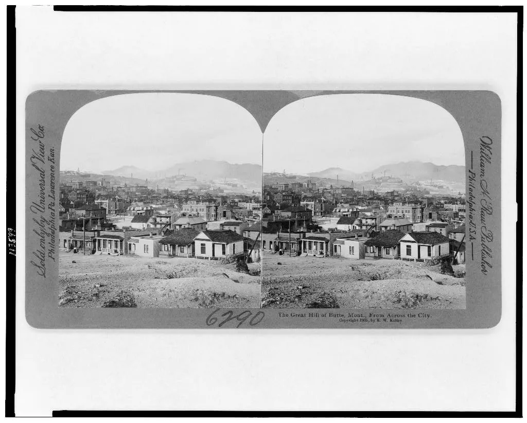 Historical stereograph showing paired views across Butte toward the mining hill