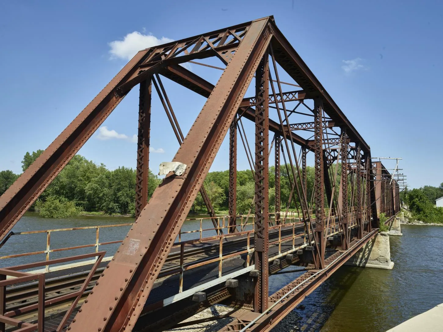 Steel railroad bridge crossing the river in Cedar Rapids, Iowa.