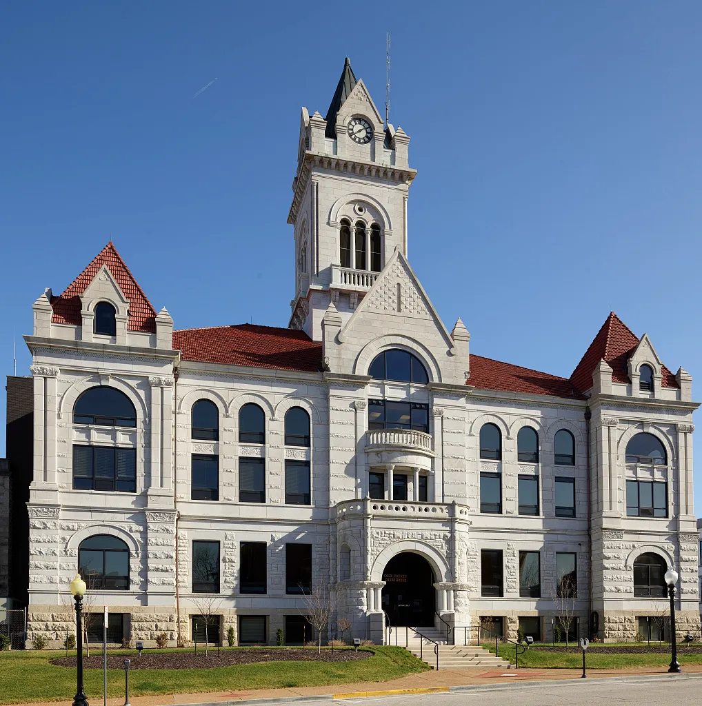 Cole County Courthouse with a central clock tower and red tiled roofs