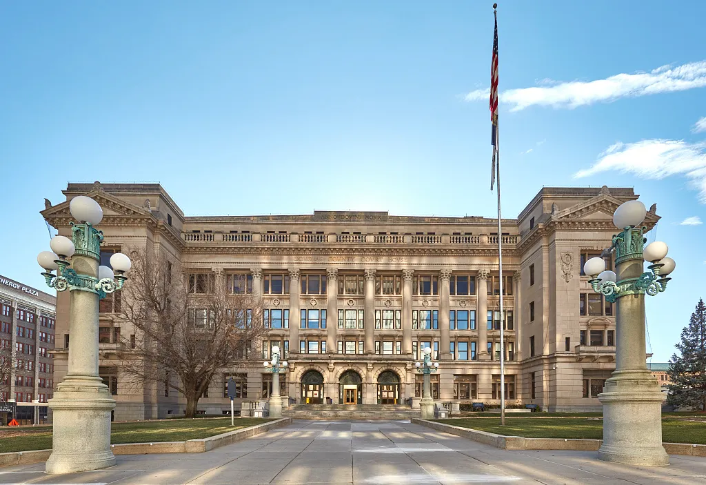 Douglas County Courthouse in Omaha seen across a paved approach