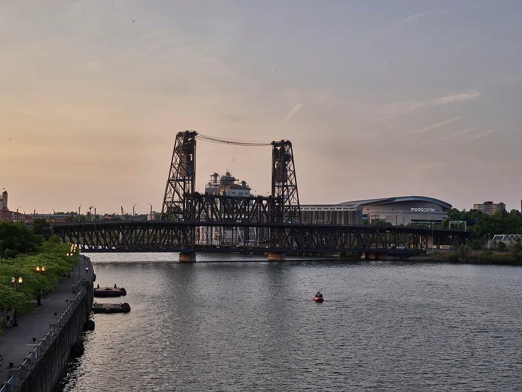 Portland’s Steel Bridge spans the Willamette River in a later city view